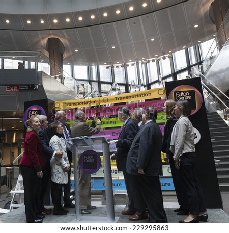 New York, NY - November 9, 2014: US Senator Chuck Schumer cuts ribbon during opening ceremony Fulton Center unveiled by Metropolitan Transit Authority during opening ceremony on Broadway in Manhattan