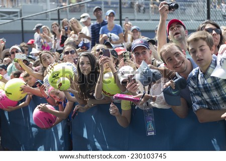 NEW YORK, NY - AUGUST 31, 2014: Fans waiting to get autograph by Roger Federer at US Open tennis tournament in Flushing Meadows USTA