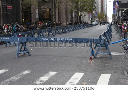New York, NY USA - November 27, 2014: Police barricade do not cross line on 6th Avenue