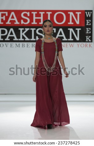 New York, NY - November 28, 2014: Model walks runway for Iquera\'s Couture at Pakistan Fashoin Week in Studio 05