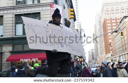 New York, NY USA - December 13, 2014: Protesters march against police brutality and grand jury decision on Eric Garner case on 6th Avenue