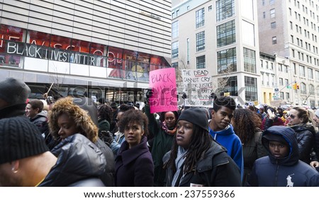 New York, NY USA - December 13, 2014: Protesters march against police brutality and grand jury decision on Eric Garner case on 5th Avenue