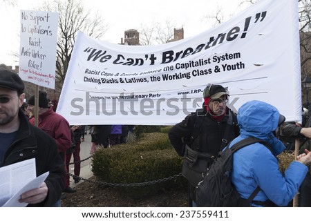 New York, NY USA - December 13, 2014: Protesters march against police brutality and grand jury decision on Eric Garner case on Washington Square