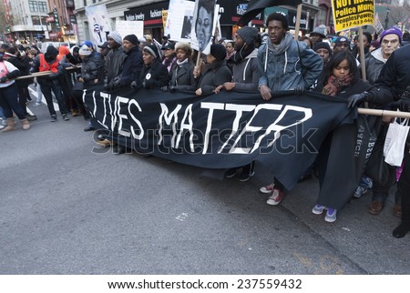 New York, NY USA - December 13, 2014: Protesters march against police brutality and grand jury decision on Eric Garner case on Broadway