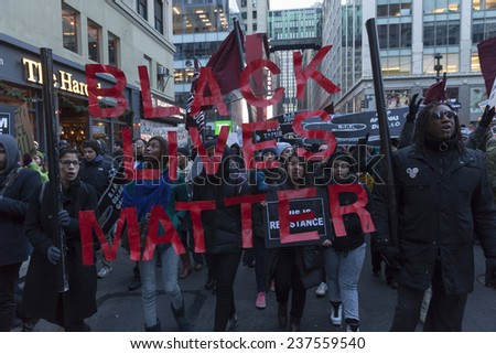 New York, NY USA - December 13, 2014: Protesters march against police brutality and grand jury decision on Eric Garner case on Broadway and 32nd street