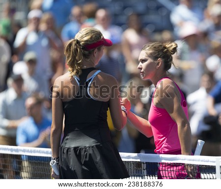NEW YORK, NY - AUGUST 25: Danielle Rose Collins of USA & Simona Halep of Romania greet each other after 1st round match at US Open tennis tournament in Flushing Meadows USTA Tennis Center 2014