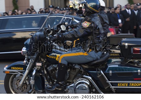 NEW YORK, NY - DECEMBER 27, 2014: Police offiicer on Motorcycle from Delaware attends Christ Tabernacle Church for the funeral of slain New York City Police Officer Rafael Ramos