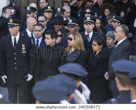 NEW YORK, NY - DECEMBER 27, 2014: Maritza Ramos, Justin Ramos and Jared Ramos attend Christ Tabernacle Church for the funeral of slain New York City Police Officer Rafael Ramos