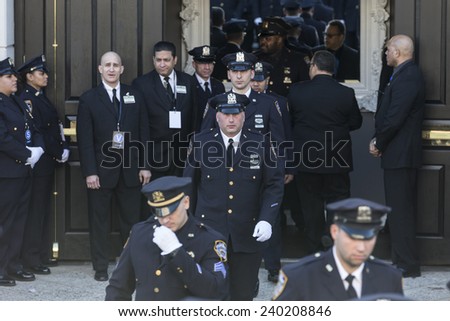 NEW YORK, NY - DECEMBER 27, 2014: Police officers from around the country gather outside of Christ Tabernacle Church for the funeral of slain New York City Police Officer Rafael Ramos