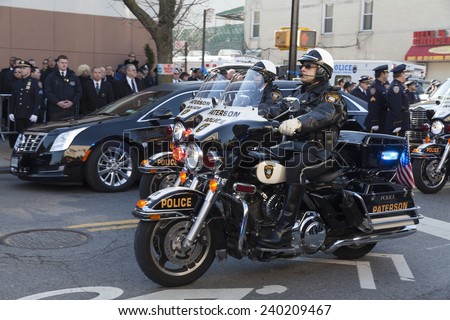 NEW YORK, NY - DECEMBER 27, 2014: Police officer on Motorcycle from Paterson, NJ attends Christ Tabernacle Church for the funeral of slain New York City Police Officer Rafael Ramos