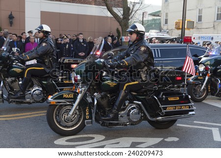 NEW YORK, NY - DECEMBER 27, 2014: Police offiicer on Motorcycle from Jersey City attends Christ Tabernacle Church for the funeral of slain New York City Police Officer Rafael Ramos