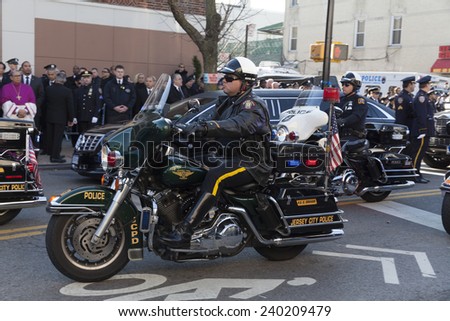 NEW YORK, NY - DECEMBER 27, 2014: Police officer on Motorcycle from Jersey City attends Christ Tabernacle Church for the funeral of slain New York City Police Officer Rafael Ramos