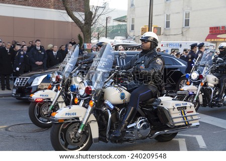 NEW YORK, NY - DECEMBER 27, 2014: Police officer on Motorcycle from Philadelphia attends Christ Tabernacle Church for the funeral of slain New York City Police Officer Rafael Ramos