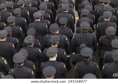 Brooklyn, NY - January 04, 2015: Police officers from around the country gather outside Aievoli Funeral Home for the funeral of slain New York City Police Officer Wenjian Liu
