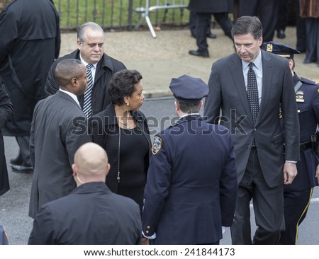 Brooklyn, NY - January 04, 2015: FBI Director James Comey & Loretta Lynch nominee for Attorney General attend ceremony at Aievoli Funeral Home for the funeral of slain NYC Police Officer Wenjian Liu