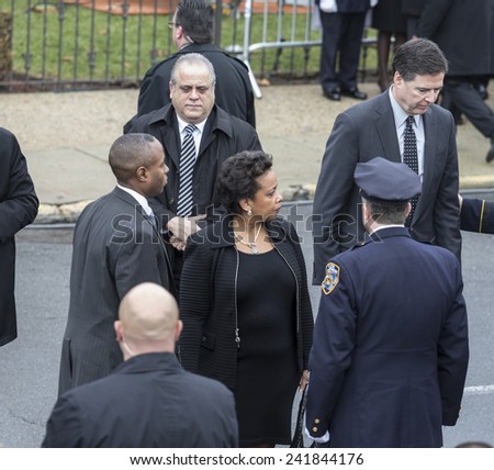 Brooklyn, NY - January 04, 2015: FBI Director James Comey & Loretta Lynch nominee for Attorney General attend ceremony at Aievoli Funeral Home for the funeral of slain NYC Police Officer Wenjian Liu