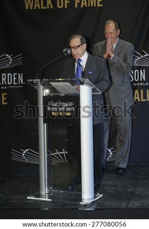New York, NY - May 11, 2015: Photographer George Kalinsky speaks at the Madison Square Garden 2015 Walk of Fame Inductions Ceremony at Madison Square Garden as Bill Bradley listens