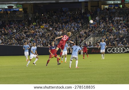 New York, NY - May 15, 2015: Jeff Larentowicz of Chicago Fire (20) & David Villa of NYCFC (7) fight for the ball during the game between New York City Football Club & Chicago Fire FC at Yankee Stadium