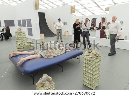 NEW YORK, NY - MAY 14, 2015: Public examine live installation on first day of Frieze Art Fair on Randall\'s Island at booth by Temnikova & Kasela