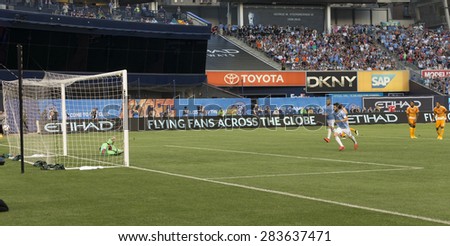New York, NY - May 30, 2015: David Villa (7) of NYCFC scores goal from penalty mark during the game between New York City Football Club and Houston Dynamo at Yankee Stadium