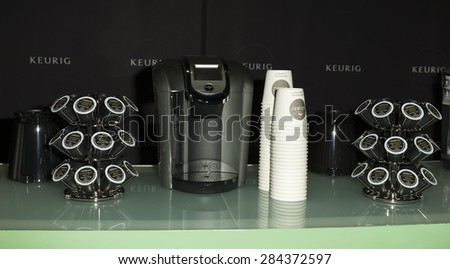 New York, NY - June 04, 2015: Coffee cups and Keurig coffee machine on display during premiere DUKALEÃ¢??S DREAM documentary at SVA theater in Manhattan