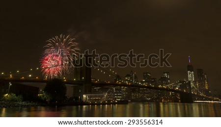 New York, NY USA - July 4, 2015: View of lower Manhattan skyline with Brooklyn bridge and One World Trade Center during Macy\'s 4th of July fireworks