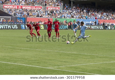New York, NY - July 12, 2015: David Villa performs penalty kick during game between New York City FC and Toronto FC at Yankee Stadium
