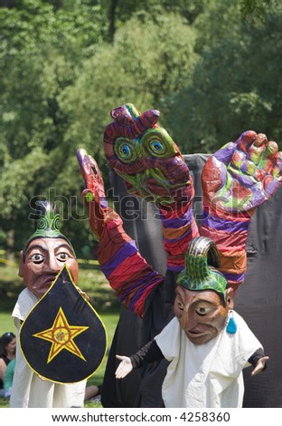 street clowns perform puppet theater
