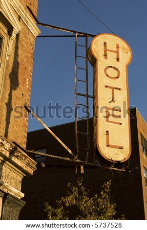 Old antique rusted unnamed hotel sign in New York