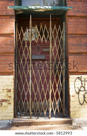 locked rusted old door leading to nowhere in New York