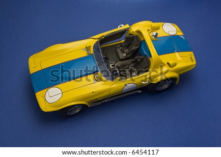 convertible sport car model view from above on blue background