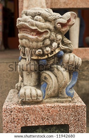 Male lion guards entrance of the Buddhist temple in Taiwan