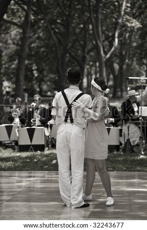 NEW YORK - JUNE 6: Couple in period clothing dance at 5th Annual Jazz age concert and picnic on Governors Island on June 6 2009 in New York