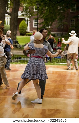 NEW YORK - JUNE 6: Couple in period clothing dance at 5th Annual Jazz age concert and picnic on Governors Island on June 6 2009 in New York