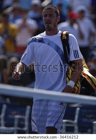 NEW YORK - SEPTEMBER 2: Marat Safin leaves court for the last time in his career after losing 1st round match to Jurgen Melzer of Austria at US Open on September 2, 2009 in New York.