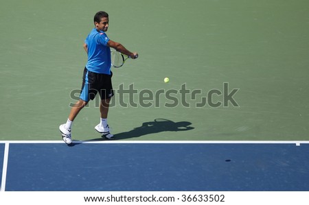 NEW YORK - SEPTEMBER 6: Nicolas Almagro of Spain returns a shot during match against Rafael Nadal of Spain at US Open on September 6, 2009 in New York.
