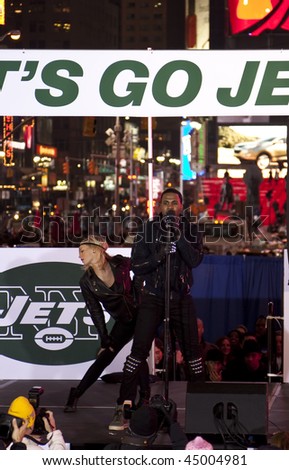 NEW YORK - JANUARY 21: Recording artist Jason Derulo (R) performs at the New York Jets AFC Championship game pep rally in Times Square on January 21, 2010 in New York City.