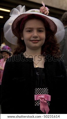NEW YORK - APRIL 4: A young girl partakes and shows off her hat in the Easter Bonnet Parade on 5th Avenue on April 4, 2010 in New York City.