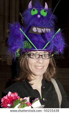 NEW YORK - APRIL 4: A woman partakes and shows off her hat in the Easter Bonnet Parade on 5th Avenue on April 4, 2010 in New York City.
