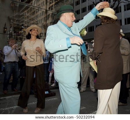NEW YORK - APRIL 4: A coupe dances at the Easter Bonnet Parade on 5th Avenue on April 4, 2010 in New York City.