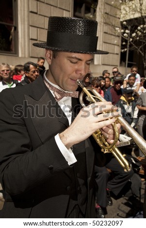 NEW YORK - APRIL 4: Michael Arenella of Dreamland Orchestra performs at the Easter Bonnet Parade on 5th Avenue on April 4, 2010 in New York City.
