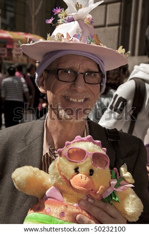 NEW YORK - APRIL 4: A man partakes and shows off her hat in the Easter Bonnet Parade on 5th Avenue on April 4, 2010 in New York City.