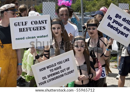 NEW YORK - JUNE 19: Unidentified participants with political signs attend Mermaid parade on Coney Island in Brooklyn on June 19, 2010 in New York City.