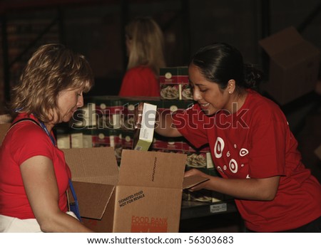 NEW YORK - JUNE 29: Unidentified volunteers help assemble meals at \'Target Party for Good\' as part of the 2010 National Conference on Volunteering on Pier 36 South Street on June 29, 2010 in N