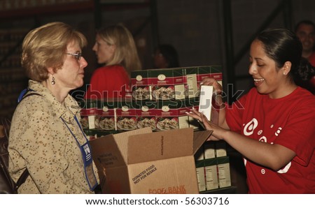 NEW YORK - JUNE 29: Unidentified volunteers help assemble meals at 'Target Party for Good' South Street on June 29, 2010 in New York City.