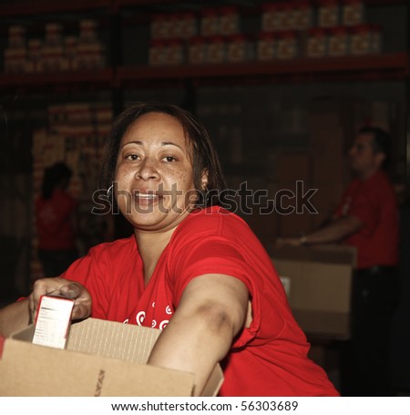 NEW YORK - JUNE 29: An unidentified volunteer helps assemble meals at \'Target Party for Good\' South Street on June 29, 2010 in New York City.