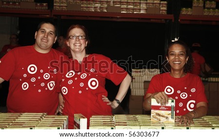 NEW YORK - JUNE 29: Unidentified volunteers help assemble meals at \'Target Party for Good\' South Street on June 29, 2010 in New York City.