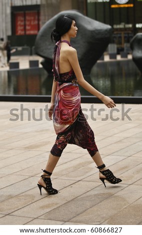 NEW YORK - SEP 12: Model walks for presentation of dress for Catherine Malandrino Collection on Spring/Summer 2011 during Mercedes-Benz Fashion Week on Sep 12, 2010 at Lincoln Center Promenade in NYC