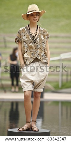 NEW YORK - SEPTEMBER 12: Model presents dress for new collection by Catherine Malandrino on Spring/Summer 2011 during Mercedes-Benz Fashion Week on September 12, 2010 in New York
