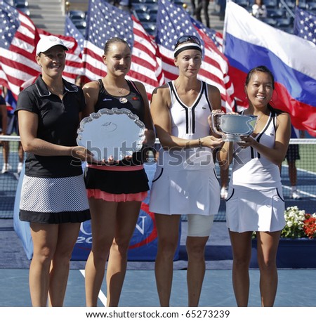NEW YORK - SEP 13: Trophy presentation women doubles champions Yaroslava Shvedova of Kazakhstan. Vania King of USA of US Open Tennis against Nadia Petrova, Liezel Huber of USA on Sep 13, 2010 in NYC